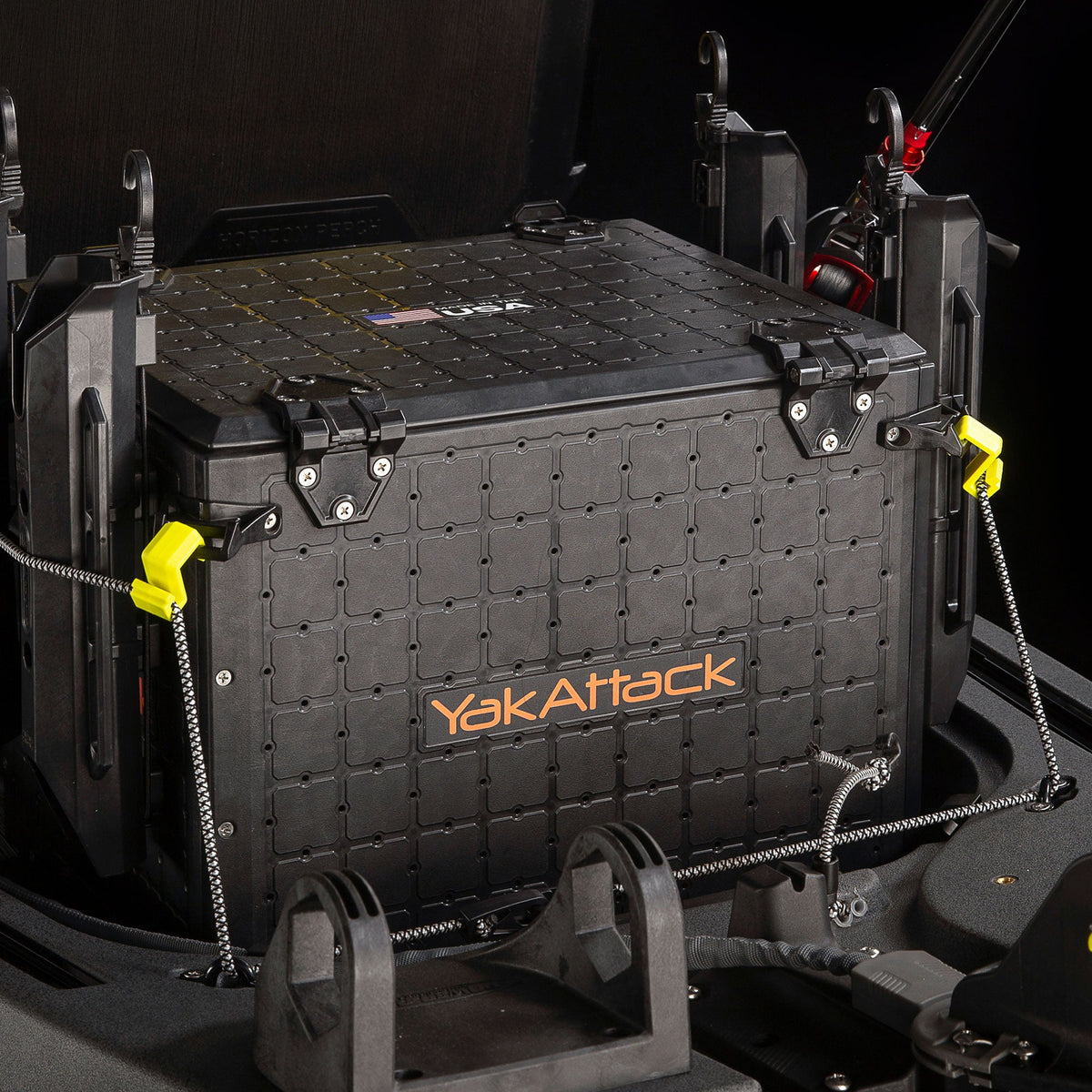Delta Grip bungee gear hooks securing a black tackle crate with yellow cord locks