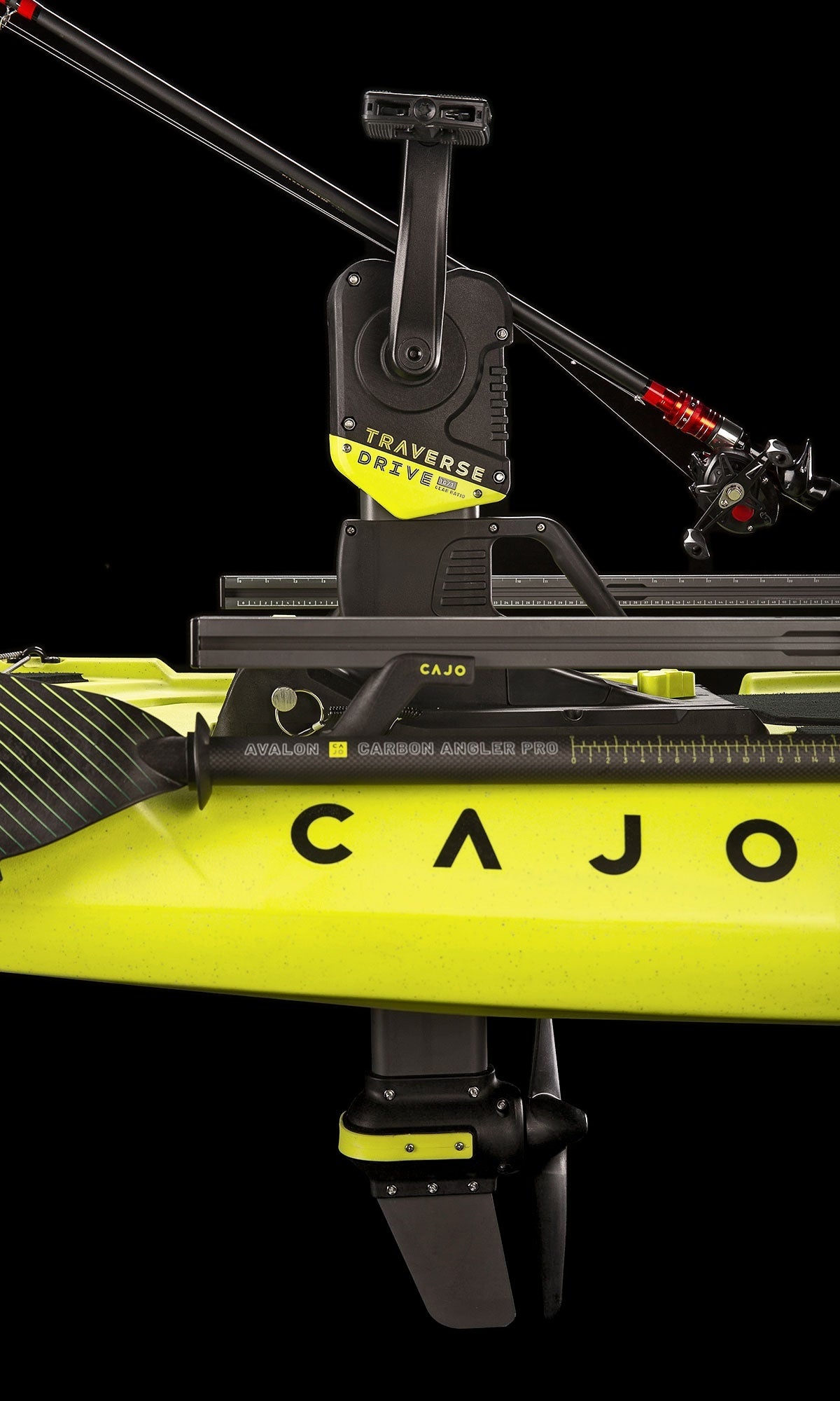 Traverse Pedal Drive installed on yellow kayak, side view with fin below hull