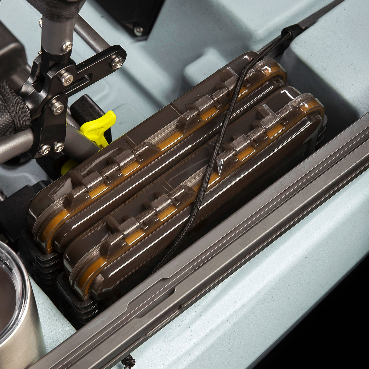 Waterproof tackle tray set stacked side by side in a kayak storage well