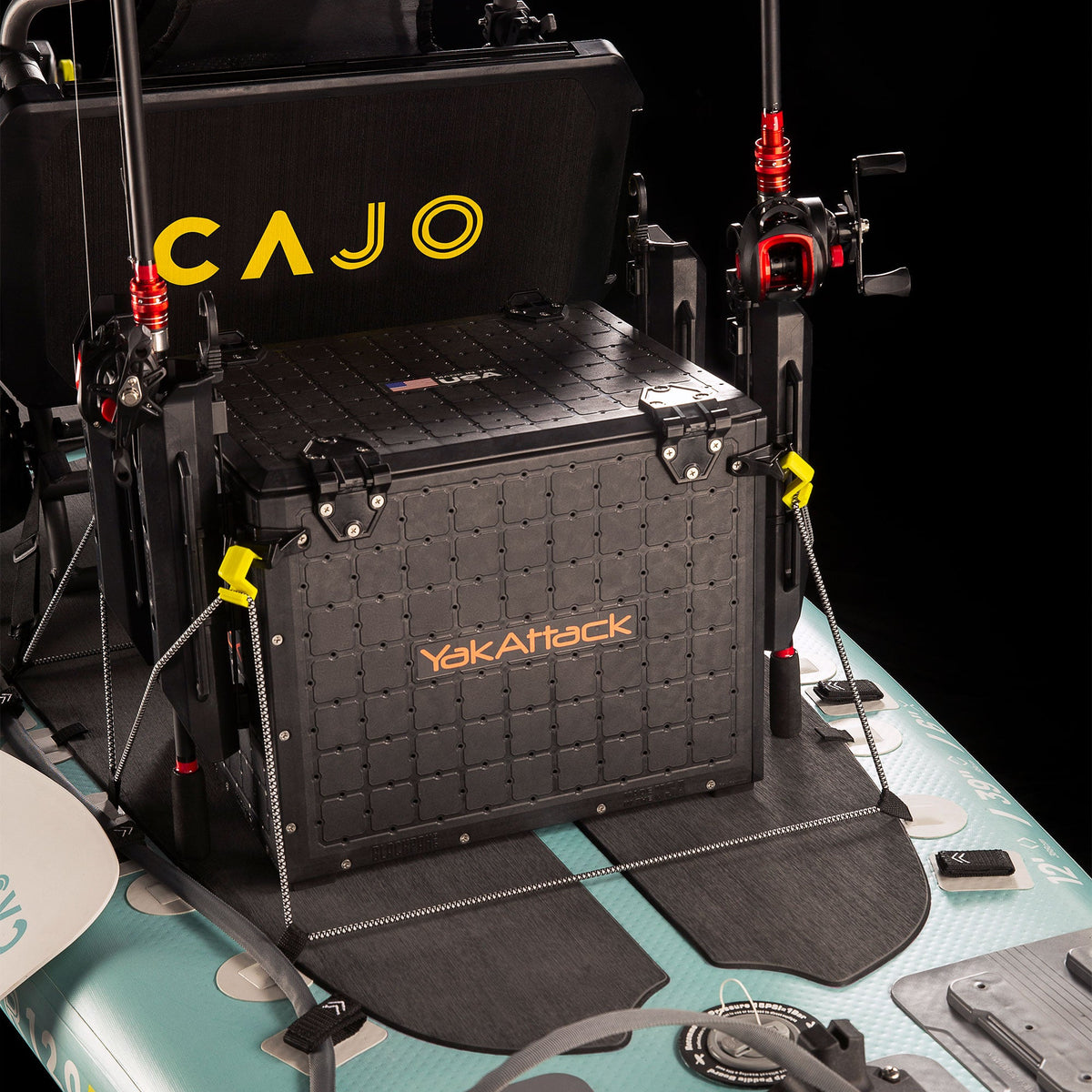 Delta Grip bungee gear hooks securing a black crate on a light blue kayak with rods