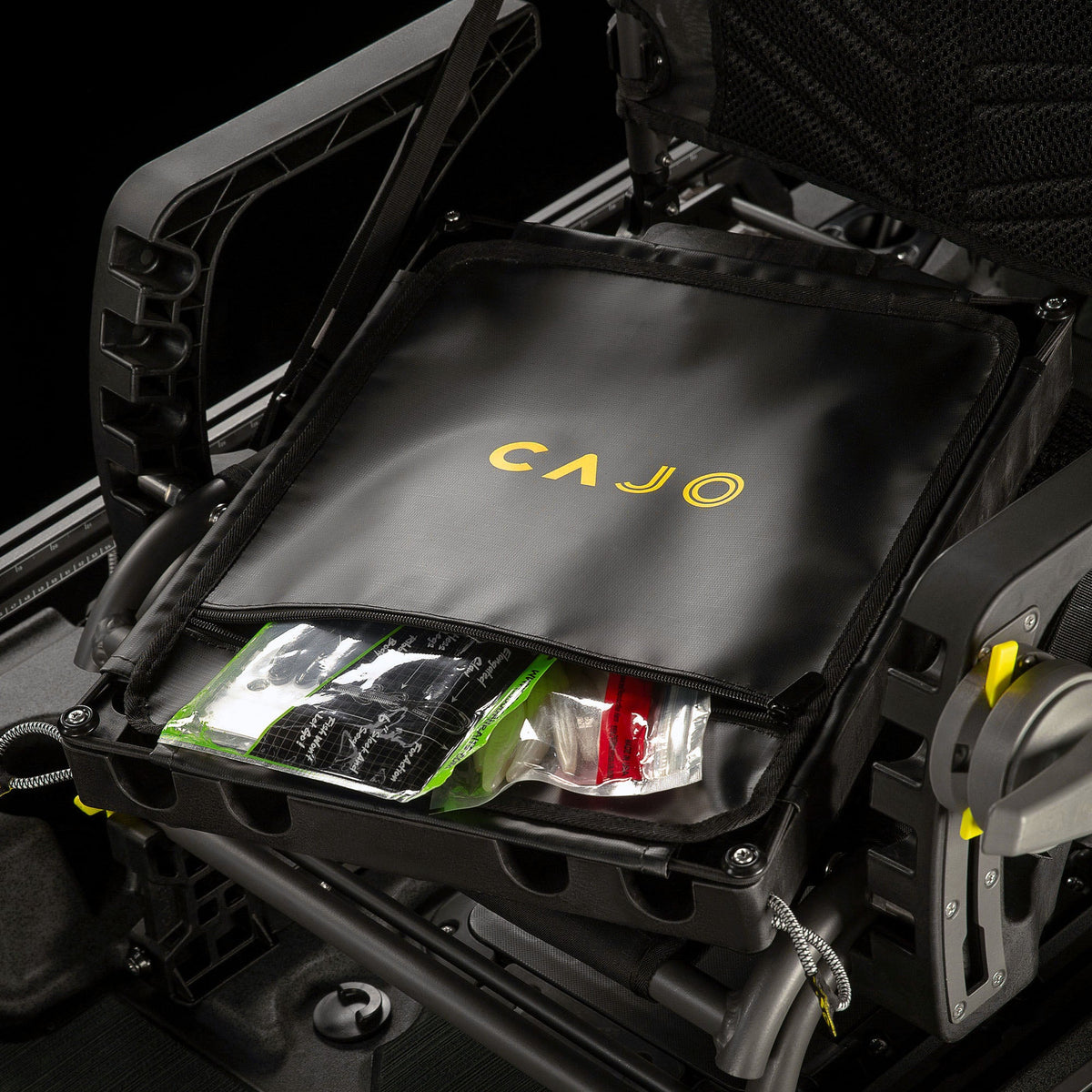 Horizon Pro kayak seat dropbox with lid lifted, showing packed lure bags