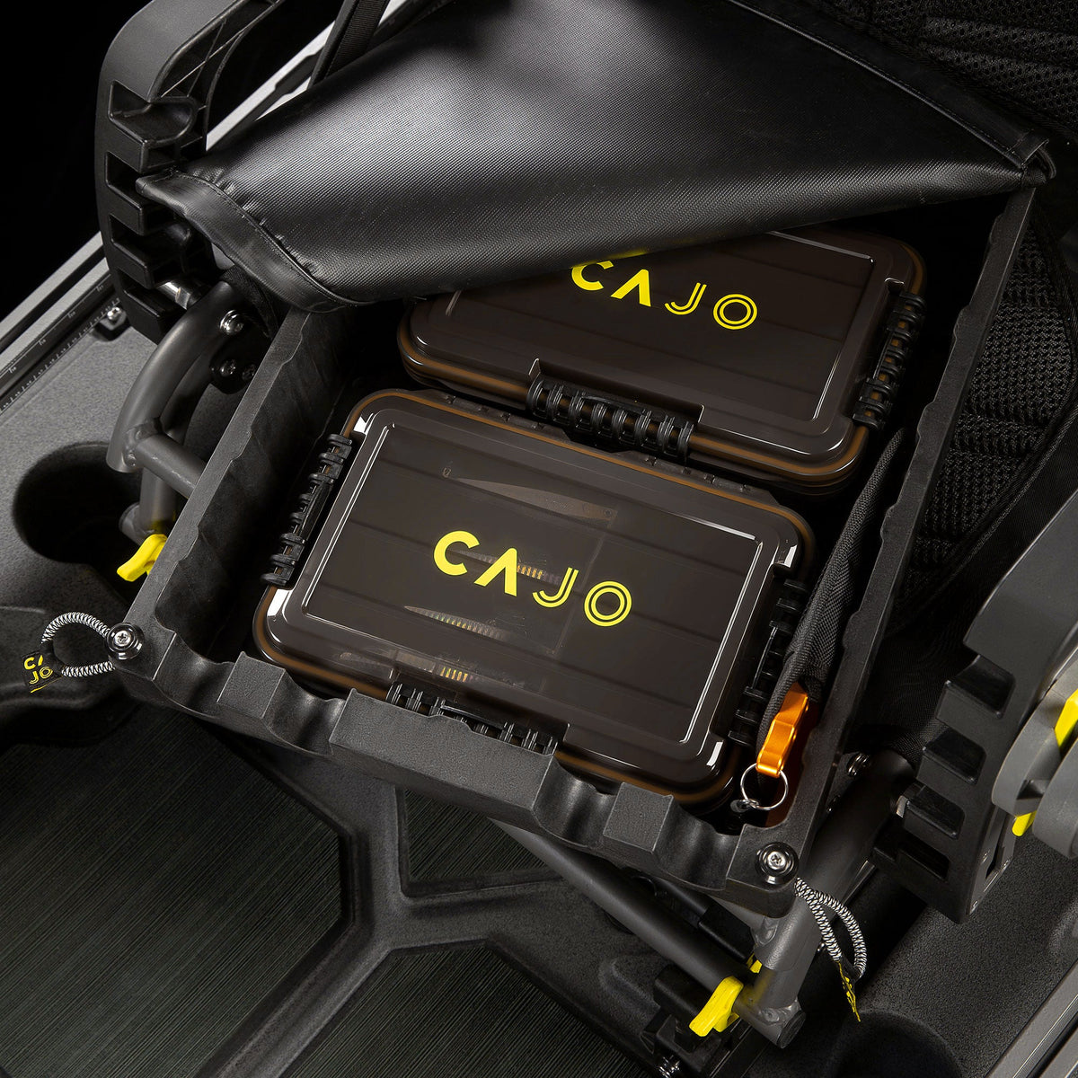Horizon Pro kayak seat dropbox open, two tackle trays with yellow Cajo logo