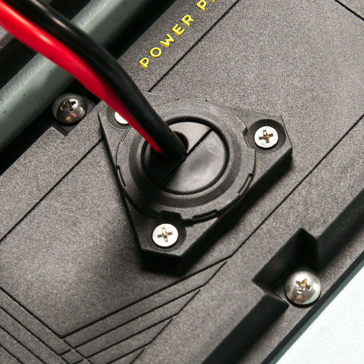 Thru hull wiring kit grommet with red and black wires through a power plate