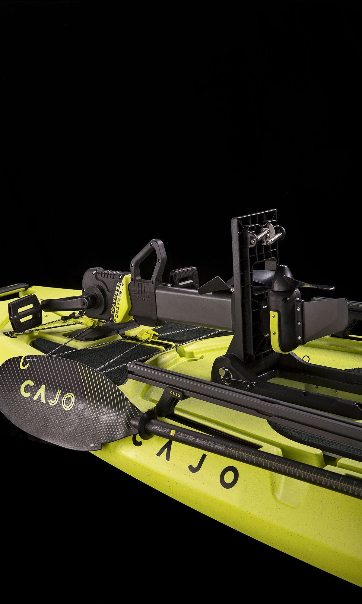 Traverse Pedal Drive on a yellow kayak with a paddle laid across the rails